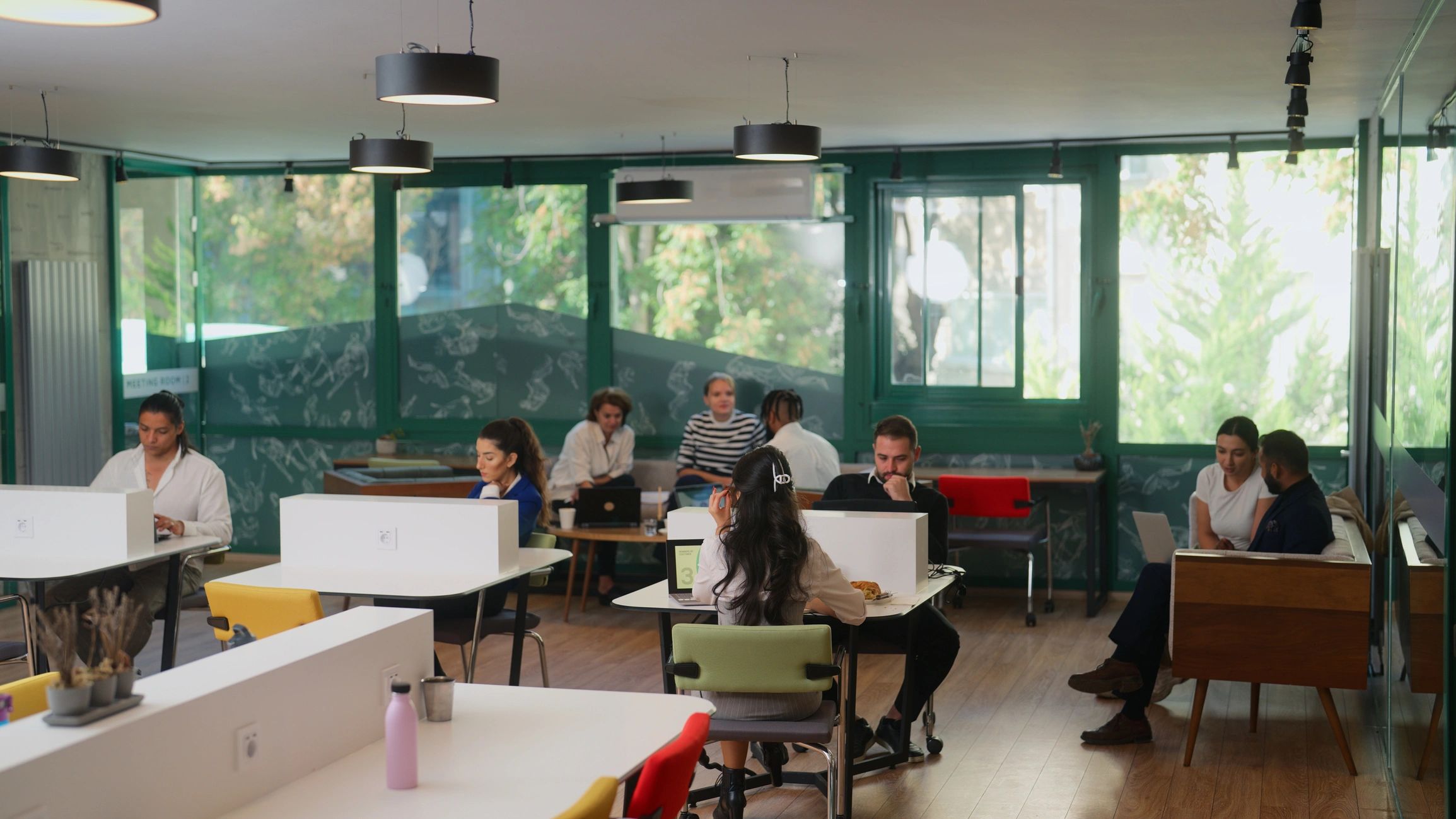 Professionals collaborating in a modern coworking office