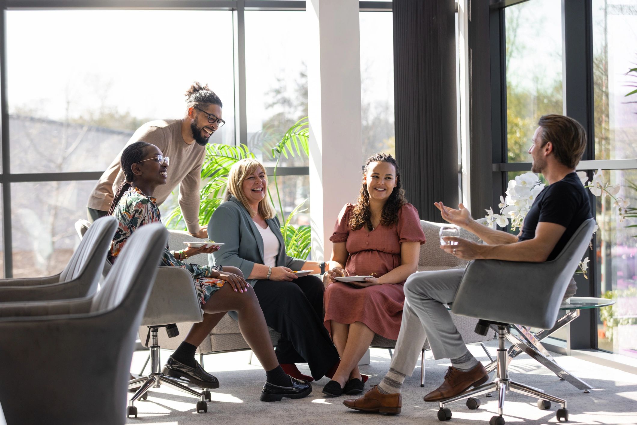 Coworking members connecting in a bright workspace